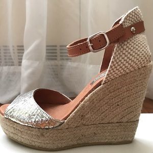 Maypol silver espadrilles with leather strap.
